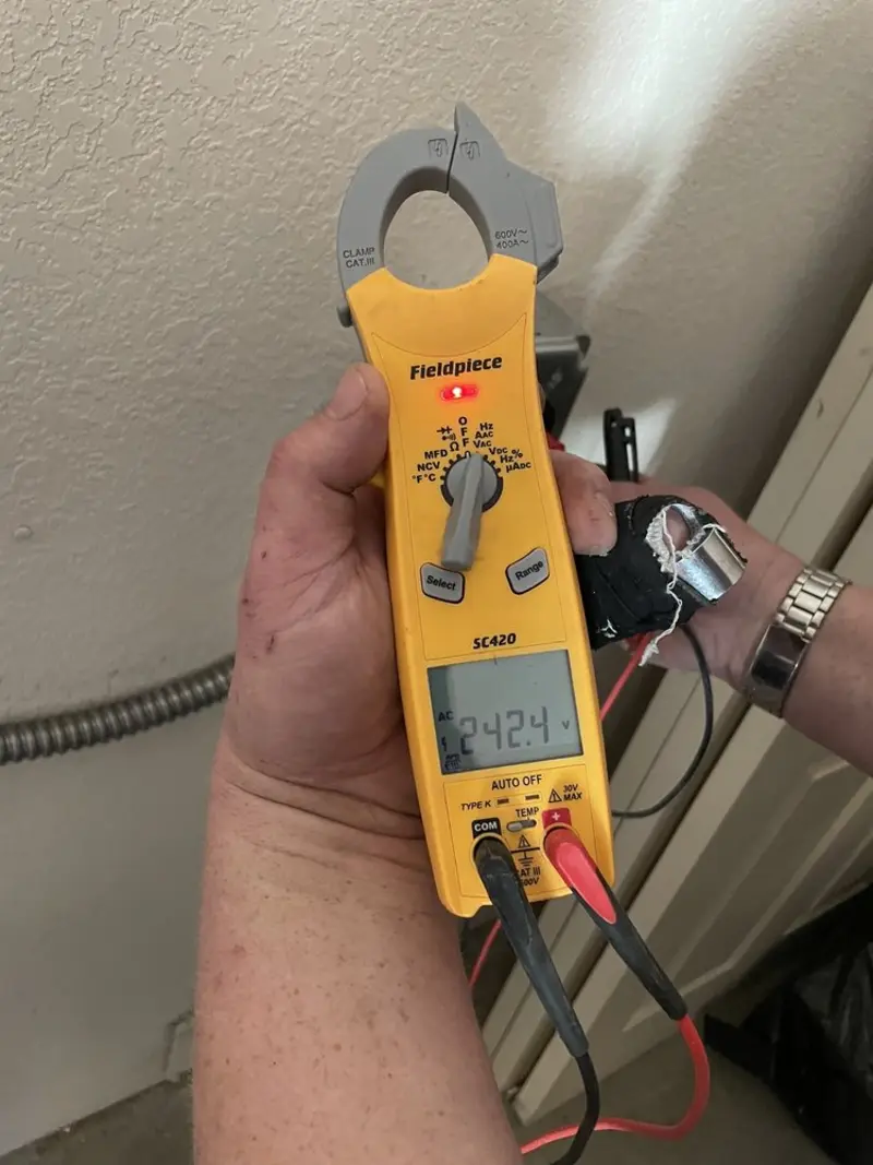 Voltage testing with clamp meter during Recessed Lighting Installation in Ripley